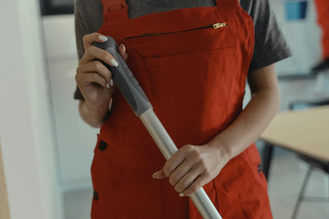 Quality Clean team member mopping an office floor